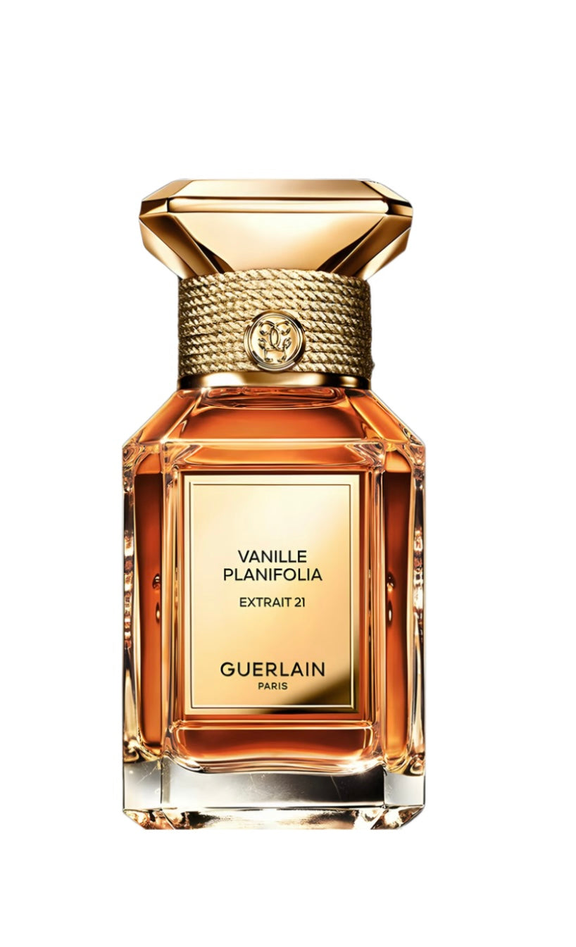 Guerlain Vanille Planifolia Extrait 21 perfume bottle with a faceted gold cap and a gold label, showcasing amber-colored liquid inside, set against a solid white background.